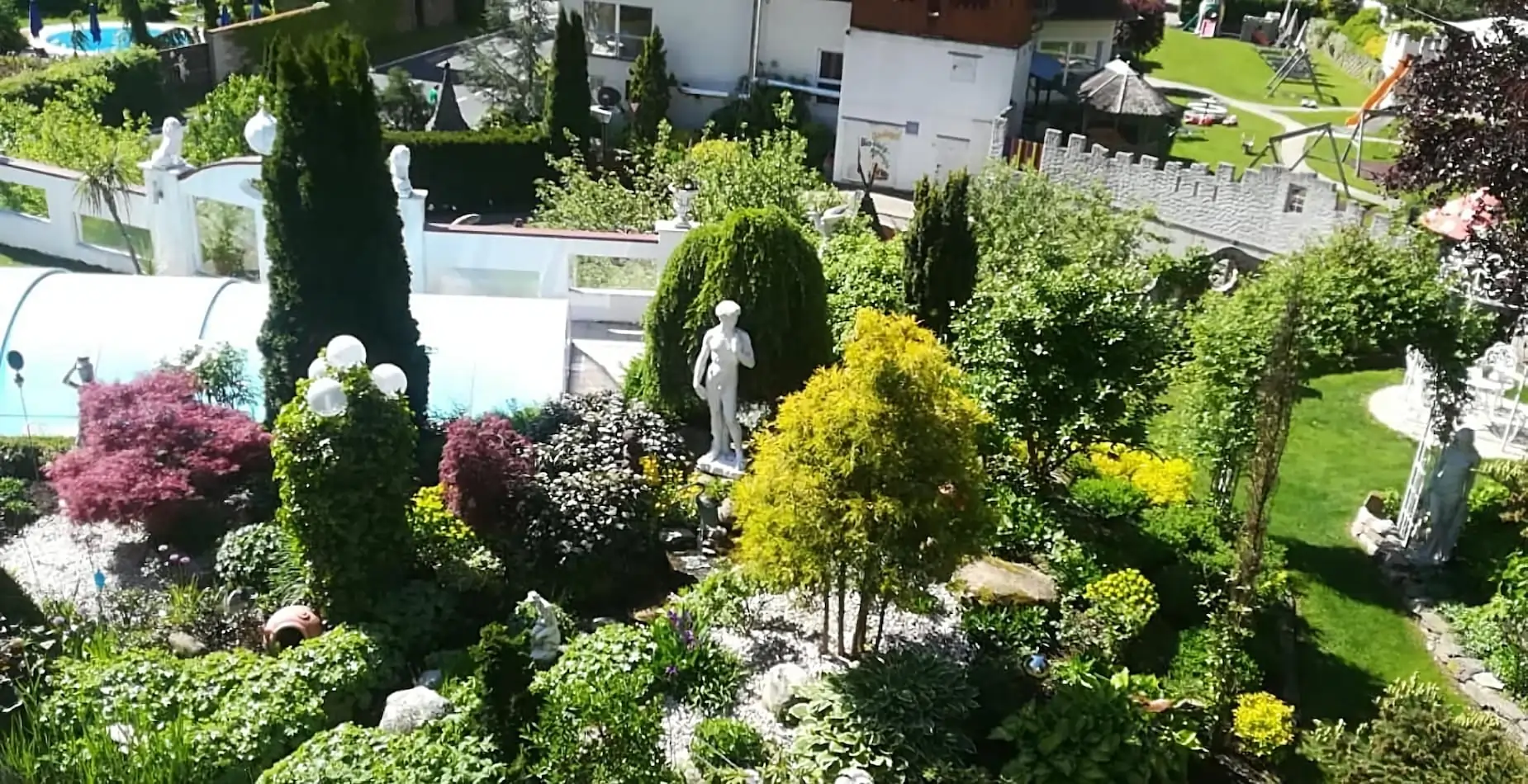 Spacious garden with pool and playground for families